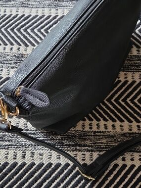 13"x5"x9" Black bag, never used. Faux pebbled leather, adjustable strap!
